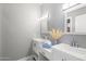 Modern bathroom featuring double sinks, elegant fixtures, and neutral decor at 4805 E Monte Cristo Ave, Scottsdale, AZ 85254
