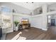 Cozy living room featuring hardwood floors, a fireplace nook, and lots of natural light at 4805 E Monte Cristo Ave, Scottsdale, AZ 85254