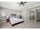 Spacious main bedroom with plush carpeting, a ceiling fan, and a serene atmosphere, bathed in soft, natural light at 4805 E Monte Cristo Ave, Scottsdale, AZ 85254