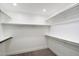 Neat, empty walk-in closet with shelving, ready for personalized organization and storage solutions at 4805 E Monte Cristo Ave, Scottsdale, AZ 85254