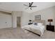 Bright main bedroom featuring a ceiling fan, carpet flooring, neutral walls, and a spacious layout at 4841 E Kirkland Rd, Phoenix, AZ 85054