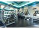 Community gym featuring treadmills, elliptical machines, and weightlifting equipment at 5345 E Van Buren St # 141, Phoenix, AZ 85008