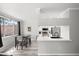 Bright dining area adjacent to kitchen, complemented by modern fixtures and ample natural light at 5345 E Van Buren St # 141, Phoenix, AZ 85008