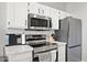 Bright, updated kitchen with modern stainless steel appliances and ample countertop space at 5345 E Van Buren St # 141, Phoenix, AZ 85008