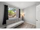 Cozy living room featuring a comfortable couch and a large window with natural light at 5345 E Van Buren St # 141, Phoenix, AZ 85008