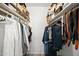 Organized walk-in closet providing ample storage space for clothing and accessories at 5345 E Van Buren St # 141, Phoenix, AZ 85008