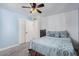 Stylish bedroom with a large window, neutral tones, and a spacious closet at 6224 E Decatur St, Mesa, AZ 85205