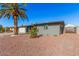Charming single-story home boasting a well-manicured front yard and a mature palm tree at 6224 E Decatur St, Mesa, AZ 85205