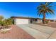 Beautiful home featuring a well-maintained front yard and a large driveway leading to a two-car garage at 6224 E Decatur St, Mesa, AZ 85205