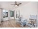 Bright and airy sun room with wood-look floors, rocking chairs, and lots of natural light at 6224 E Decatur St, Mesa, AZ 85205
