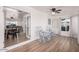 Bright and airy sun room with wood-look floors, rocking chairs, and lots of natural light at 6224 E Decatur St, Mesa, AZ 85205
