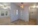 Open dining room with tile floors and modern lighting at 6708 W Patricia Ann Ln, Peoria, AZ 85382