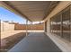 Covered patio overlooking the backyard with a privacy wall at 7220 W Medlock Dr, Glendale, AZ 85303