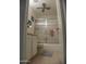Bathroom featuring a glass shower door, white vanity, tiled floor, and a ceiling fan at 7348 N Via Camello Del Norte -- # 223, Scottsdale, AZ 85258