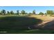 Scenic view of a lush green golf course on a sunny day with mature trees at 7348 N Via Camello Del Norte -- # 223, Scottsdale, AZ 85258