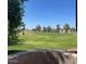 Scenic view of a well-maintained golf course from a home's patio at 7348 N Via Camello Del Norte -- # 223, Scottsdale, AZ 85258