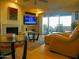 Comfortable living room with a fireplace and access to a patio, perfect for relaxing at 7348 N Via Camello Del Norte -- # 223, Scottsdale, AZ 85258