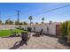 Beautiful backyard with artificial turf and a gravel area, perfect for outdoor entertaining at 7525 E Latham St, Scottsdale, AZ 85257