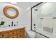 Bathroom featuring glass shower and wooden vanity with dark hardware at 7525 E Latham St, Scottsdale, AZ 85257