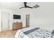Bright bedroom featuring neutral colors, a ceiling fan, and easy access to the bathroom at 7525 E Latham St, Scottsdale, AZ 85257