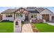 Charming home featuring a walkway, manicured landscaping, and welcoming front yard at 7525 E Latham St, Scottsdale, AZ 85257