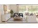 Cozy living room with comfortable seating, stylish decor, and an open view of the backyard at 7993 W Griswold Rd, Peoria, AZ 85345