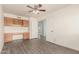 Bedroom with built-in desk and cabinets, wood-look flooring, and great natural light at 8303 E Monterey Ave, Mesa, AZ 85209