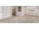 Spacious carpeted bedroom with a view to the ensuite bathroom; window provides natural light at 8303 E Monterey Ave, Mesa, AZ 85209