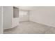Comfortable bedroom with plush carpeting, neutral walls, and a private access door at 8303 E Monterey Ave, Mesa, AZ 85209