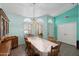 Light-filled dining area features a large table, wooden chairs, built-in hutch, and shuttered windows at 8303 E Monterey Ave, Mesa, AZ 85209