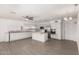 Well-lit kitchen featuring white cabinetry, stainless steel appliances, and ample counter space at 8303 E Monterey Ave, Mesa, AZ 85209