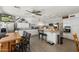 Spacious kitchen with stainless steel appliances, a gray countertops island, and an open bar area at 8303 E Monterey Ave, Mesa, AZ 85209
