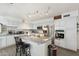 Bright and airy kitchen with modern stainless appliances, gray countertops and light wood-style flooring at 8303 E Monterey Ave, Mesa, AZ 85209