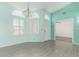 Spacious living room featuring bright walls, modern wood-look floors, and large windows at 8303 E Monterey Ave, Mesa, AZ 85209
