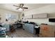 Home office with custom cabinets and drawers, a ceiling fan, a window and vinyl floors at 8303 E Monterey Ave, Mesa, AZ 85209