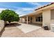 View of the covered patio that looks out onto a low maintenance gravel backyard and desert landscaping at 8303 E Monterey Ave, Mesa, AZ 85209