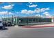 Sports court with an open gate and a view of neighborhood homes in the background at 8303 E Monterey Ave, Mesa, AZ 85209