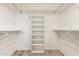 Organized walk-in closet with shelving and rods for ample storage space at 8303 E Monterey Ave, Mesa, AZ 85209