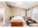 Cozy bedroom with natural light, a comfortable chair, and neutral carpeting at 1043 W Washington Ave, Gilbert, AZ 85233