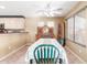 Cozy dining area featuring green chairs, a table with patterned tablecloth, and a wooden cabinet at 1043 W Washington Ave, Gilbert, AZ 85233