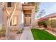 Inviting home entrance with stone accents and desert landscaping at 1043 W Washington Ave, Gilbert, AZ 85233