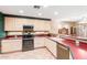 Kitchen featuring stainless steel appliances, bright cabinets, and tile flooring at 1043 W Washington Ave, Gilbert, AZ 85233