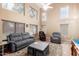 Spacious living room with high ceilings, gray sofa and chair, and plush rug at 1043 W Washington Ave, Gilbert, AZ 85233