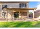 Covered patio area with outdoor seating, perfect for relaxing and entertaining guests at 1043 W Washington Ave, Gilbert, AZ 85233