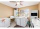 Bright room featuring white cabinets, a sewing machine, and a window at 1043 W Washington Ave, Gilbert, AZ 85233