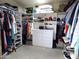 This organized walk in closet has shelving, drawers and hanging areas at 10549 E Cedar Waxwing Dr, Sun Lakes, AZ 85248