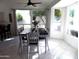 Dining area filled with light from the surrounding windows at 10549 E Cedar Waxwing Dr, Sun Lakes, AZ 85248