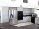 Updated kitchen with stainless appliances and white cabinets at 10549 E Cedar Waxwing Dr, Sun Lakes, AZ 85248