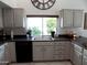 A kitchen sink in front of a garden window at 10549 E Cedar Waxwing Dr, Sun Lakes, AZ 85248