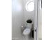 A bright toilet room shows a modern white toilet with round window at 10549 E Cedar Waxwing Dr, Sun Lakes, AZ 85248